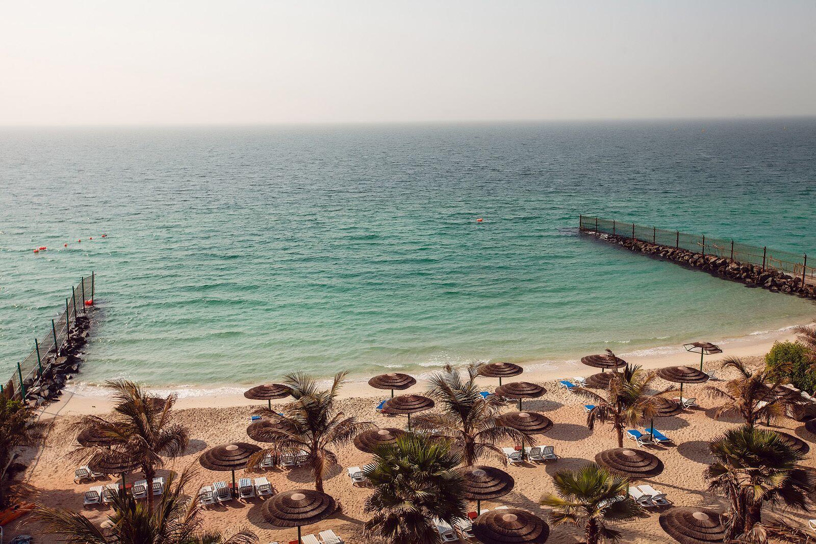 Sahara Beach Resort & Spa Sharjah Exterior foto The beach at the Kempinski Hotel, Muscat